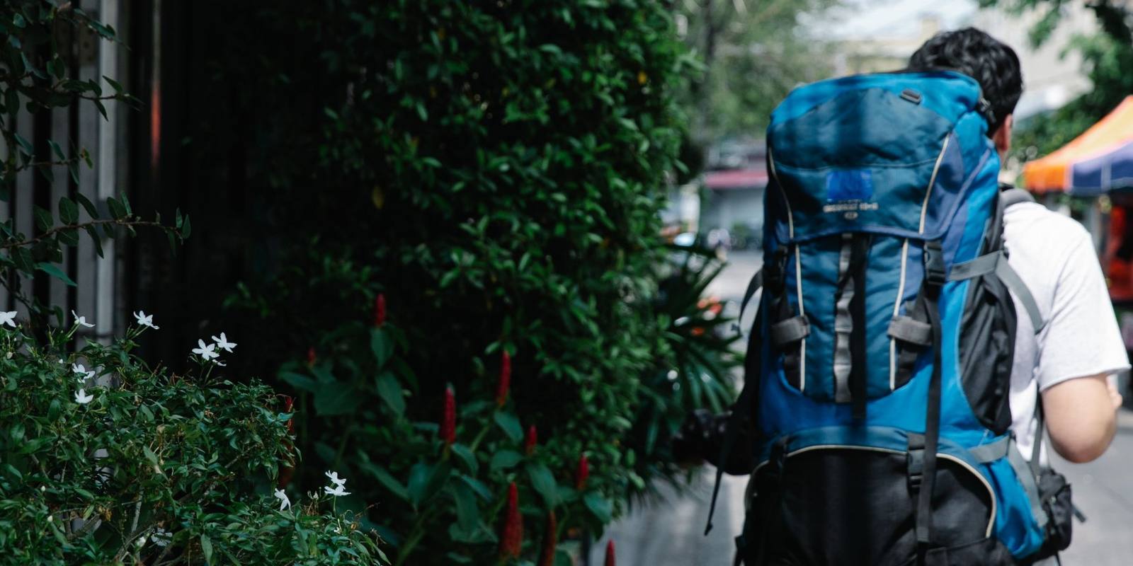 Backpacker walking down a street